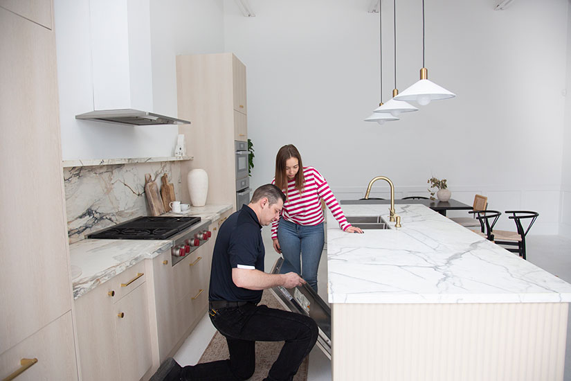 Pegasus Appliance Repair technician fixing dishwasher in St. Catharines, ON