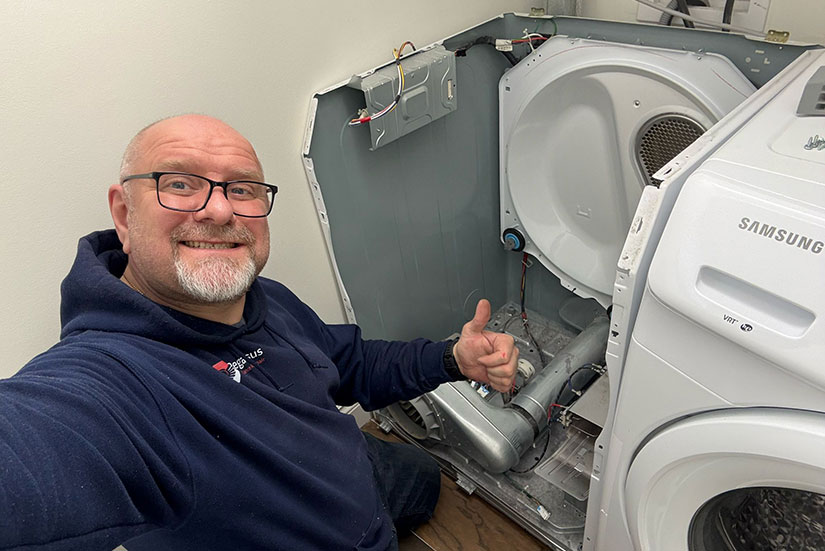 Pegasus Appliance Repair technician performing electric dryer repair at a customer’s home
